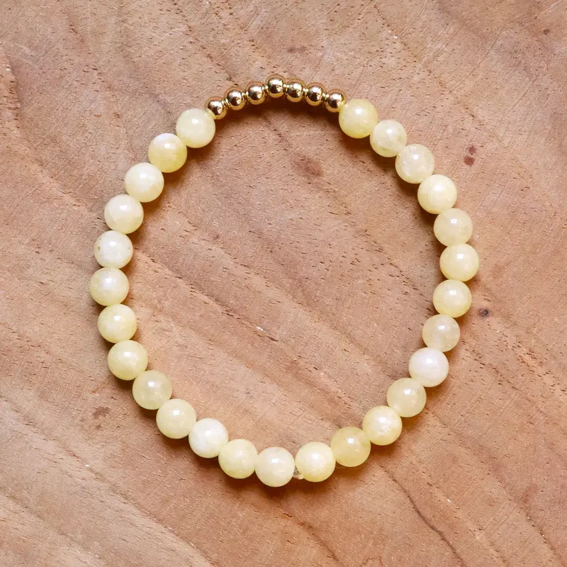 Armband kralen lichtgeel met goud