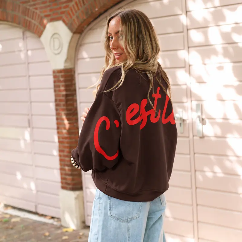 C'est la vie sweater bruin koraal
