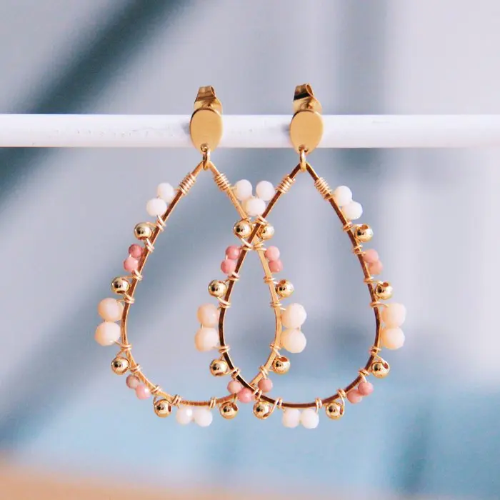 Gouden drop oorbellen met facetjes
