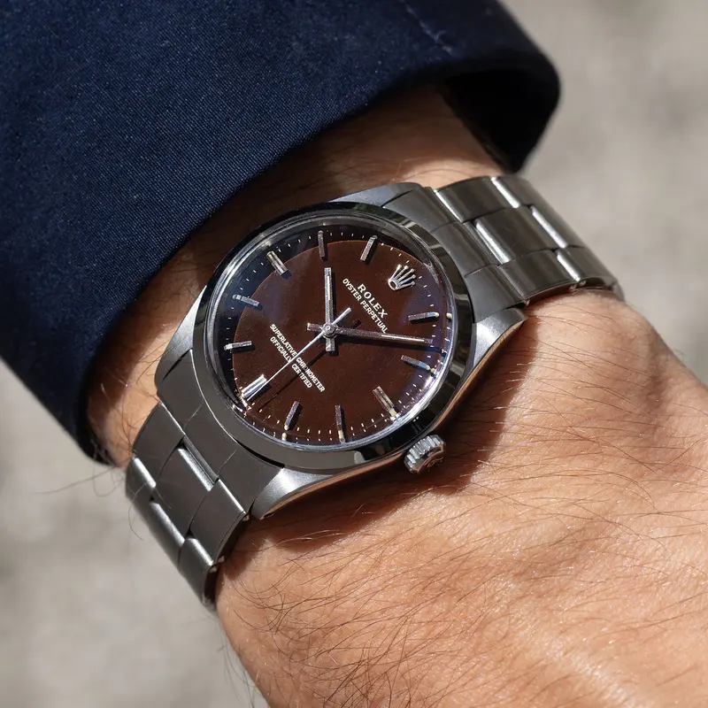 Rolex Oyster Perpetual 1002 "Burgundy Tropical Gilt Dial" with punched paper