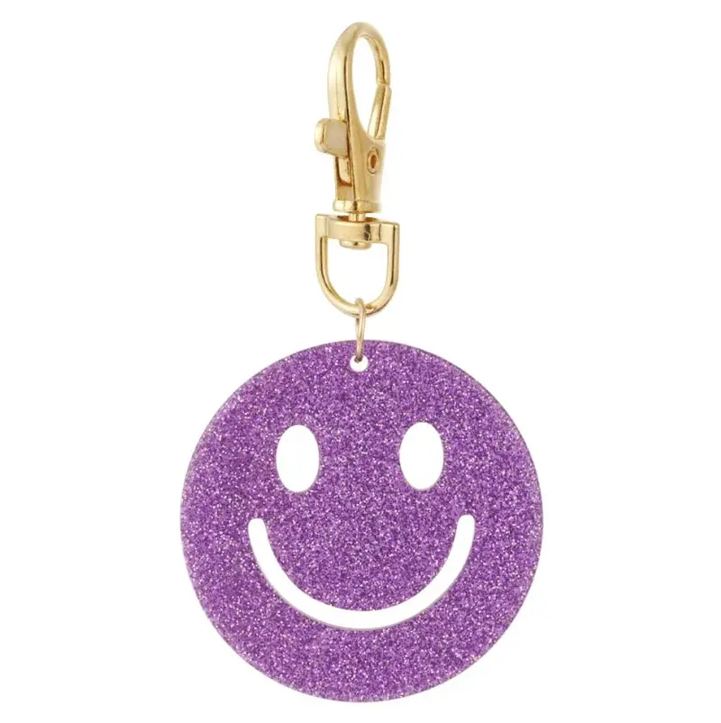 Sleutelhanger Keep Smiling goud paars