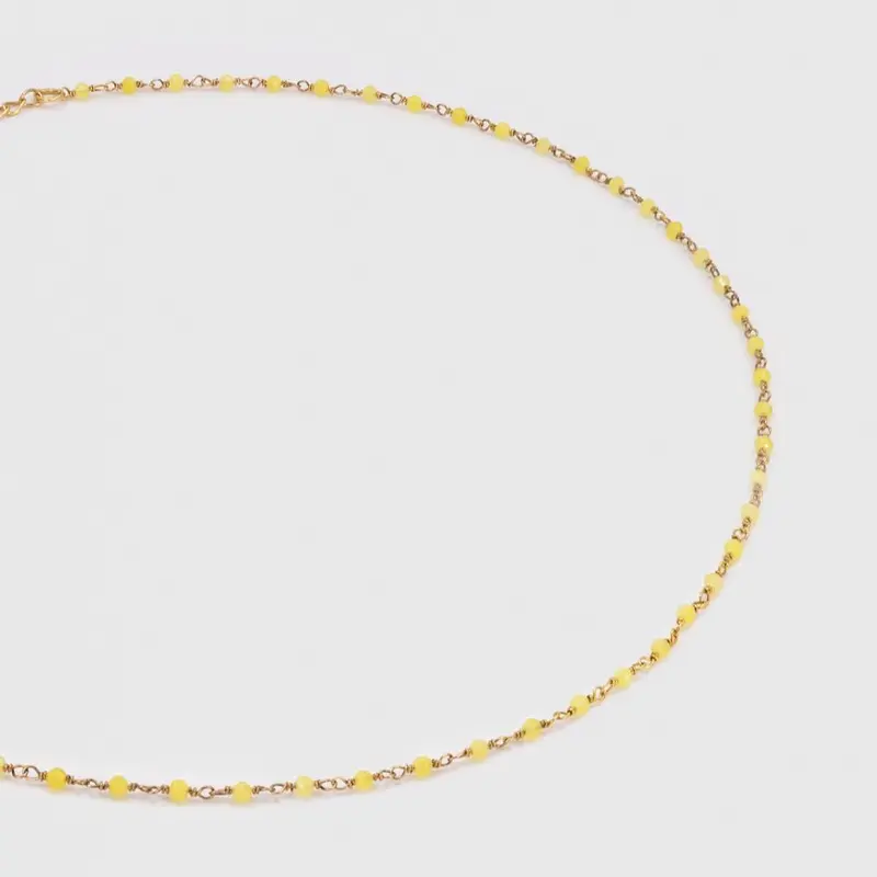 une a une ketting inde jaune