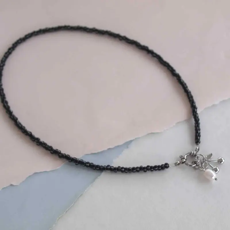 widaro ketting black white stripe beads (kies goud/zilver)